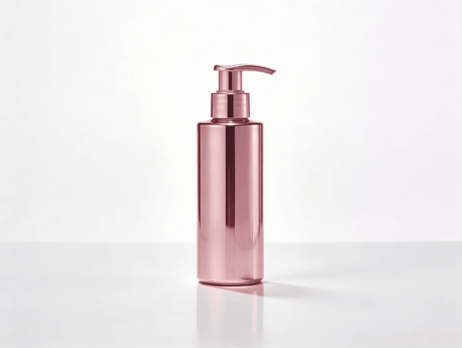 Rose gold shampoo pump bottle on a white background