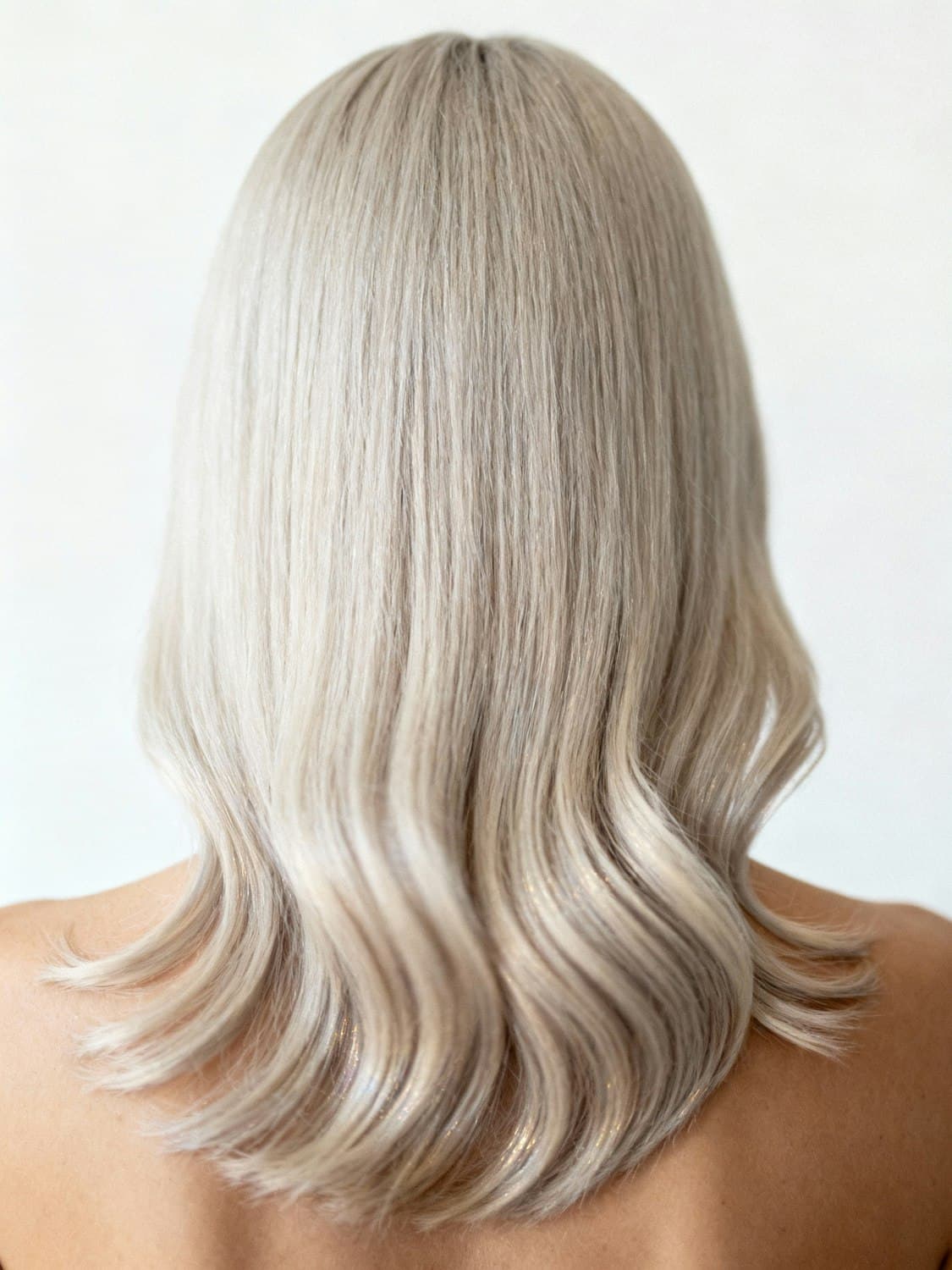 Back view of smooth, glossy platinum blonde hair